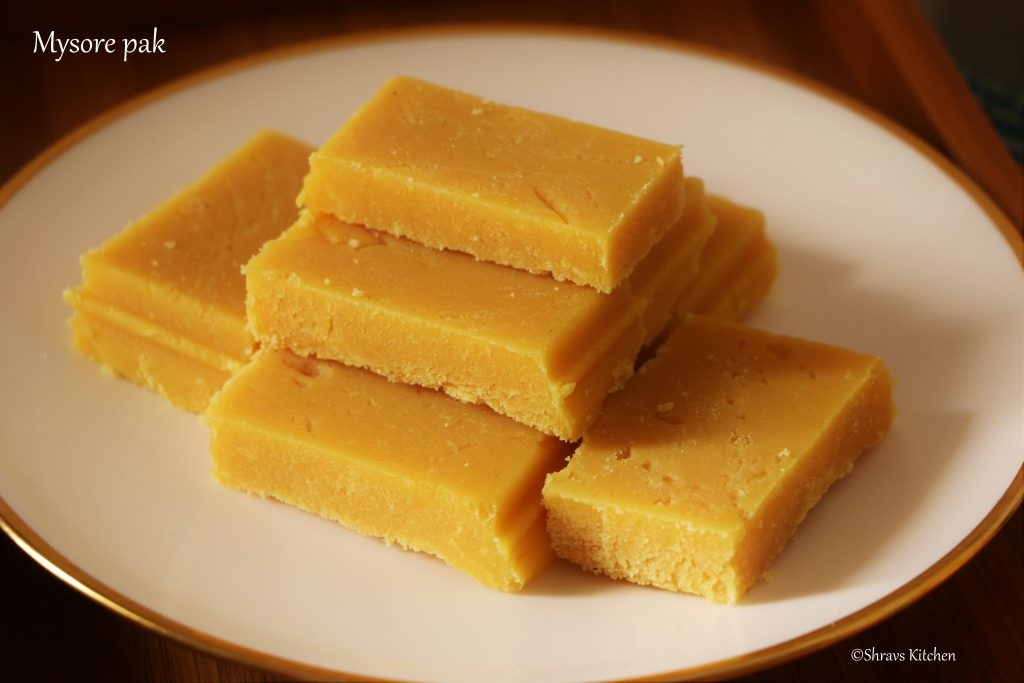 Mysore pak originally called Mysuru paaka, is an Indian sweet prepared in ghee that is popular in Southern India. It originated in Mysore in the state of Karnataka. It is made of generous amounts of ghee, sugar, gram flour. The texture of the sweet is similar to fudge.